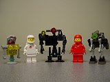 Size comparison of the first three robots and some minifigs